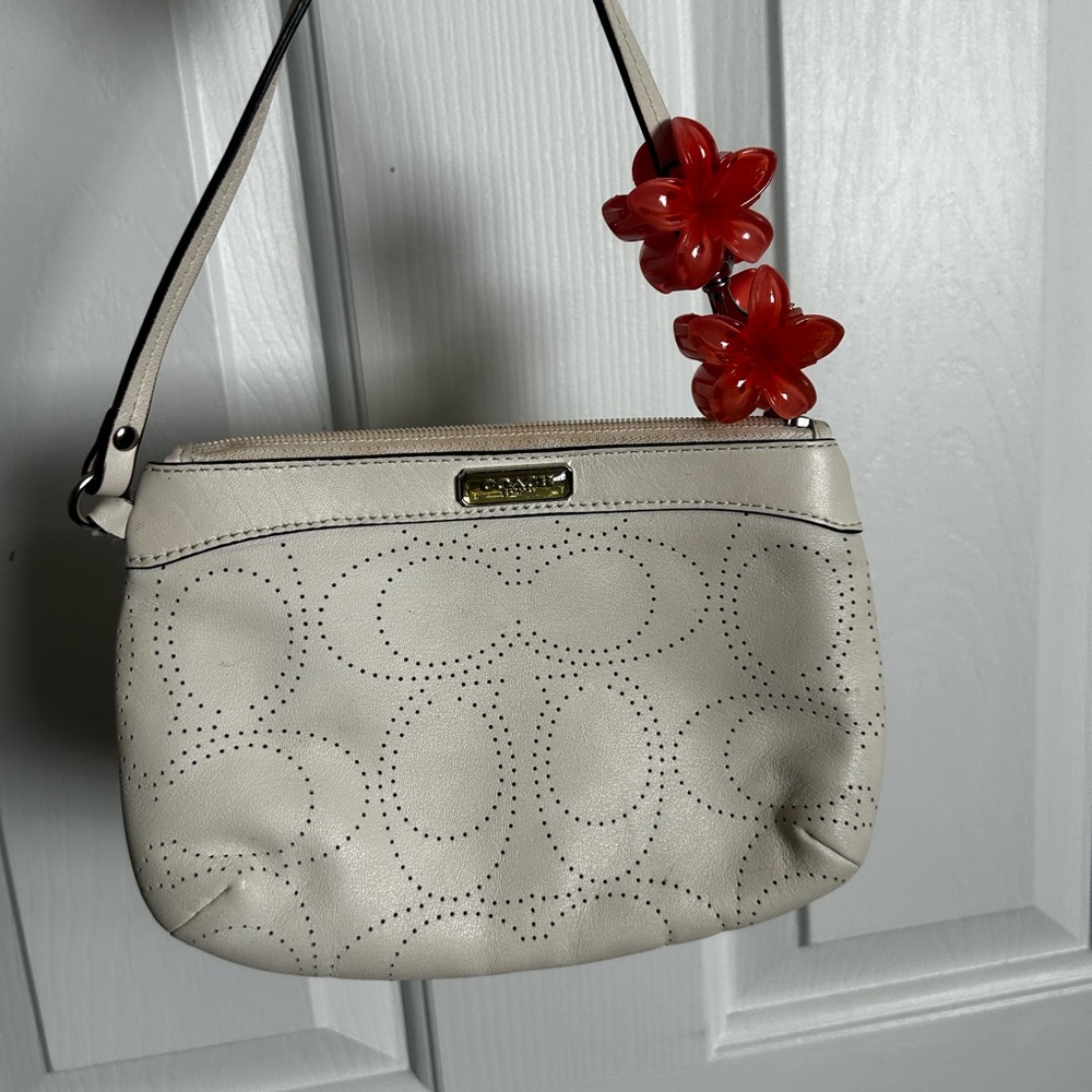Coach Cream Perforated Wristlet with Red Floral Accent